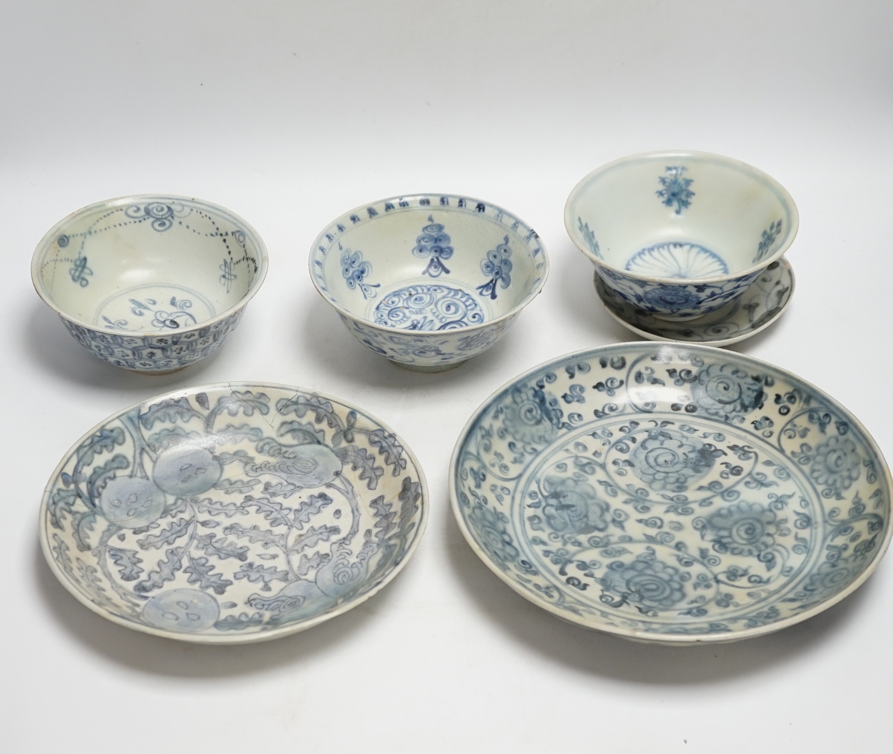 Chinese Ming dynasty shipwreck ceramics - three blue and white pottery bowls and three dishes, largest 25cm diameter